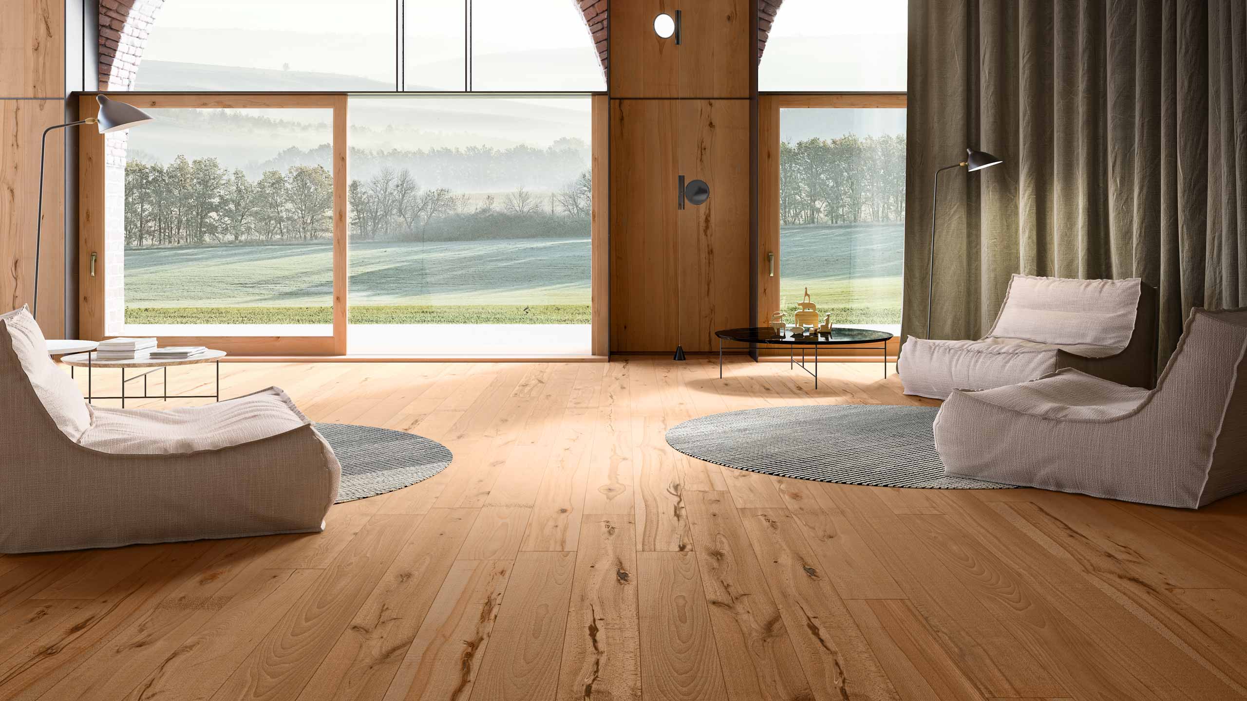 Parquet floor in the living room with wooden furniture, large windows and views of the landscape.